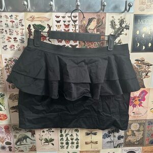 Size large Peplum skirt by Material girl. Zip up in back. Great condition